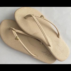 White flip flops w/charm